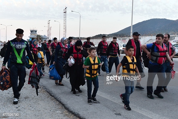  Migrants make their way to the Mytilene after disembarking on the Greek island of Lesbos (AFP/Getty Images).